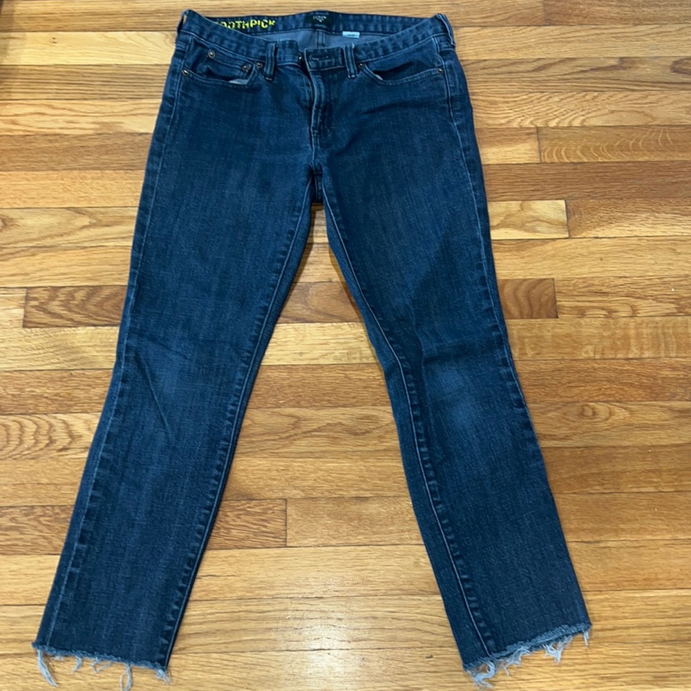Toothpick stretch jeans with rough fringe ankle.